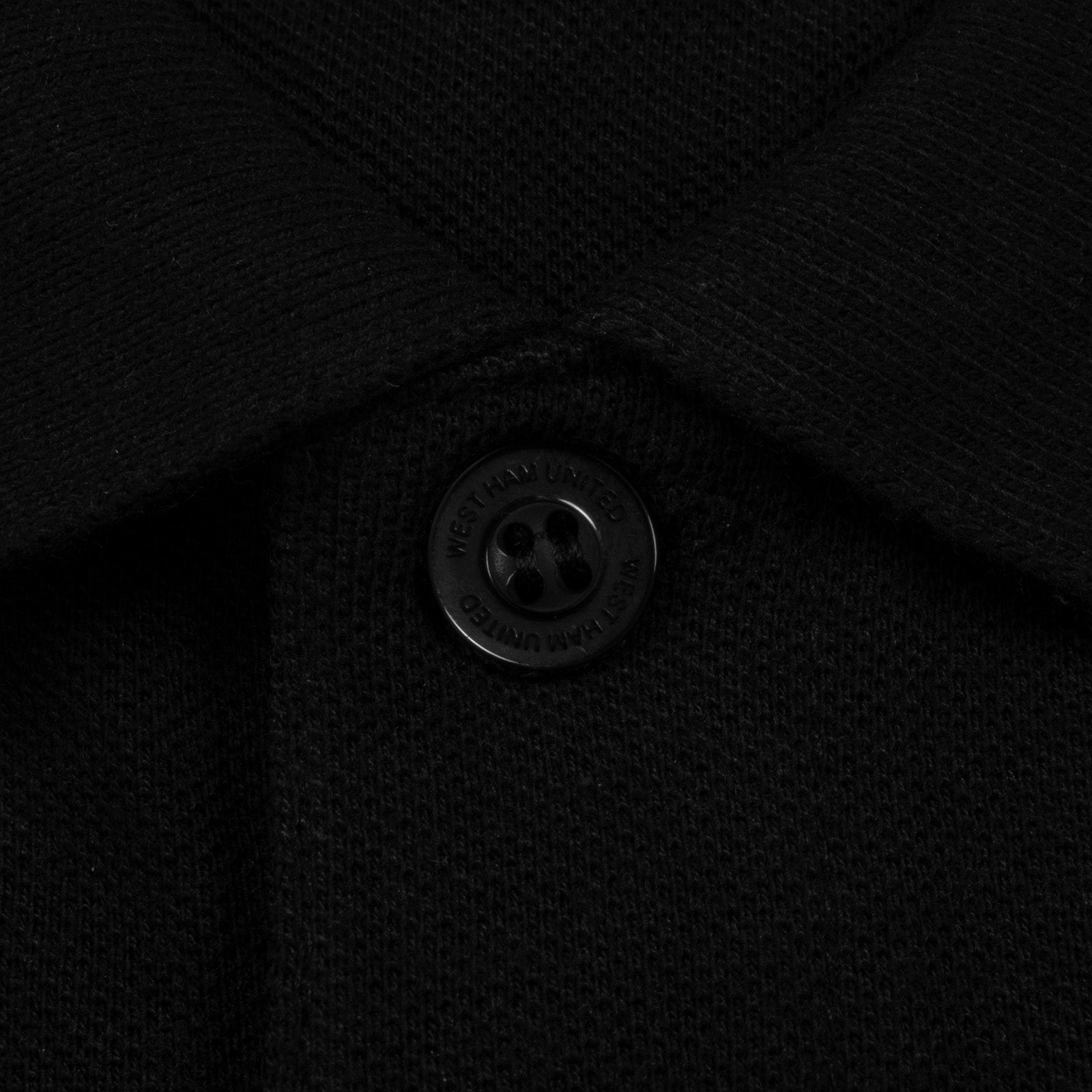 West Ham adults polo shirt in black with WHUFC badge and text to chest.