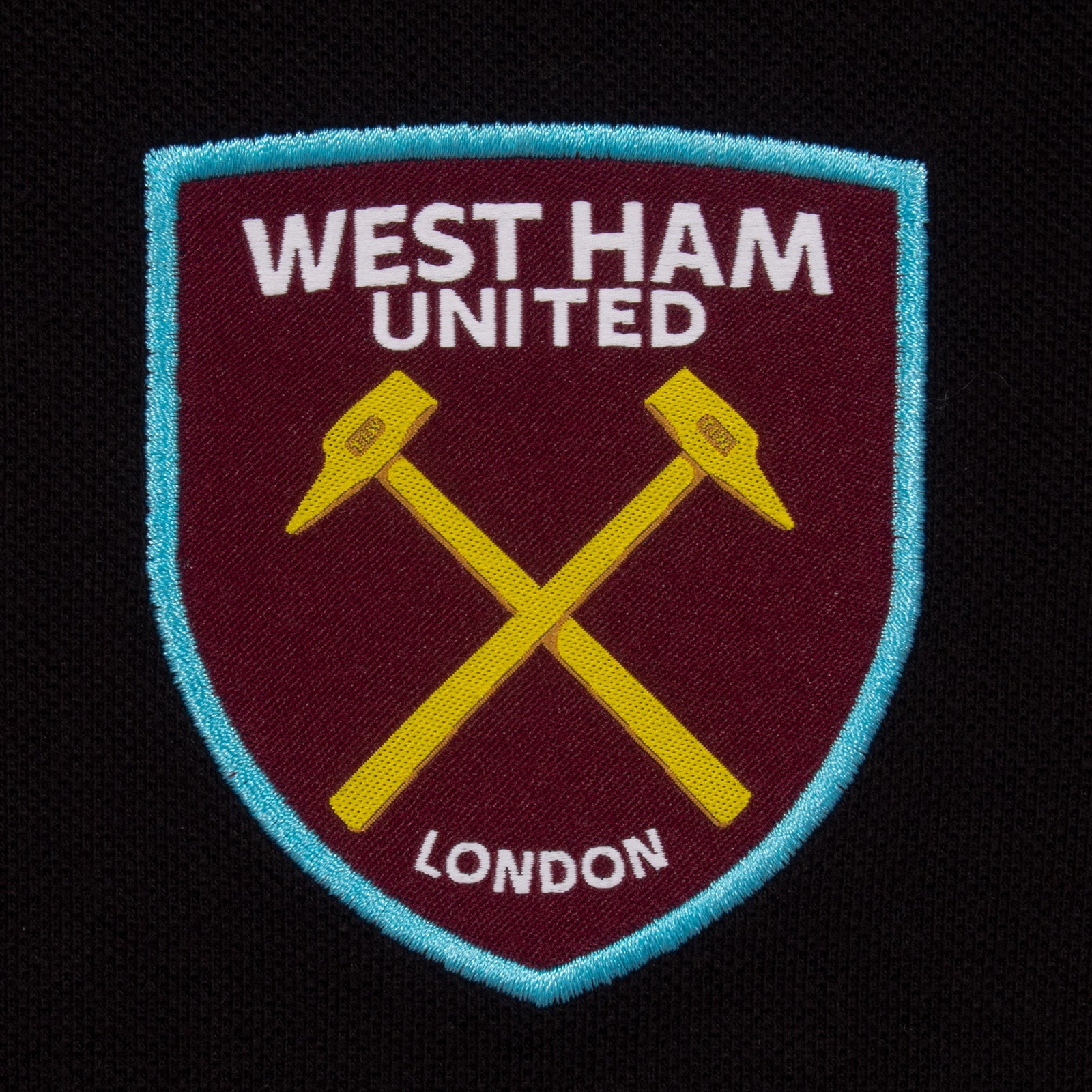 West Ham adults polo shirt in black with WHUFC badge and text to chest.