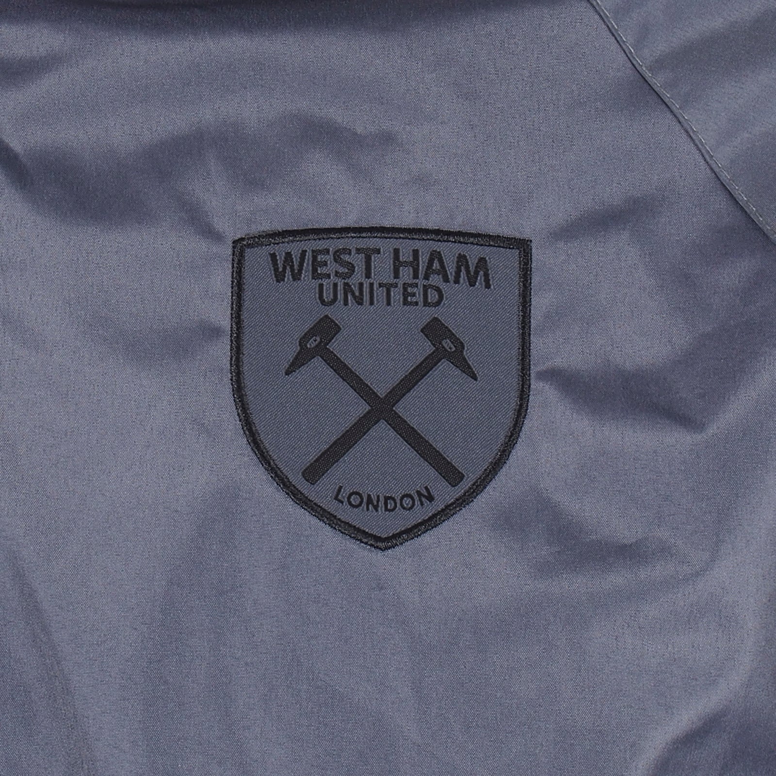 West Ham adults shower jacket in grey with club crest and pockets to front