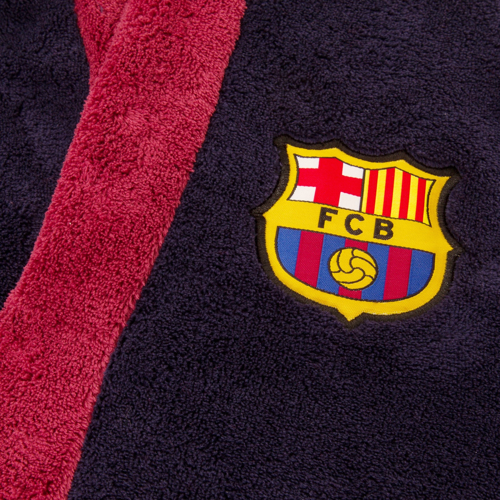FC Barcelona kids hooded dressing gown in navy blue with FCB crest.
