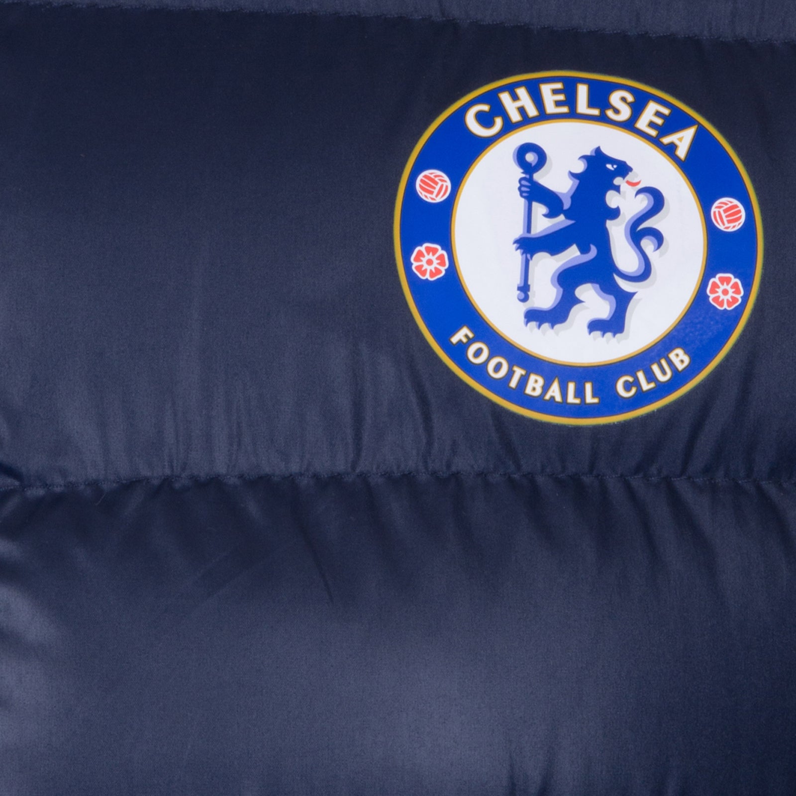 Chelsea adults quilted jacket in navy blue with club crest to chest.