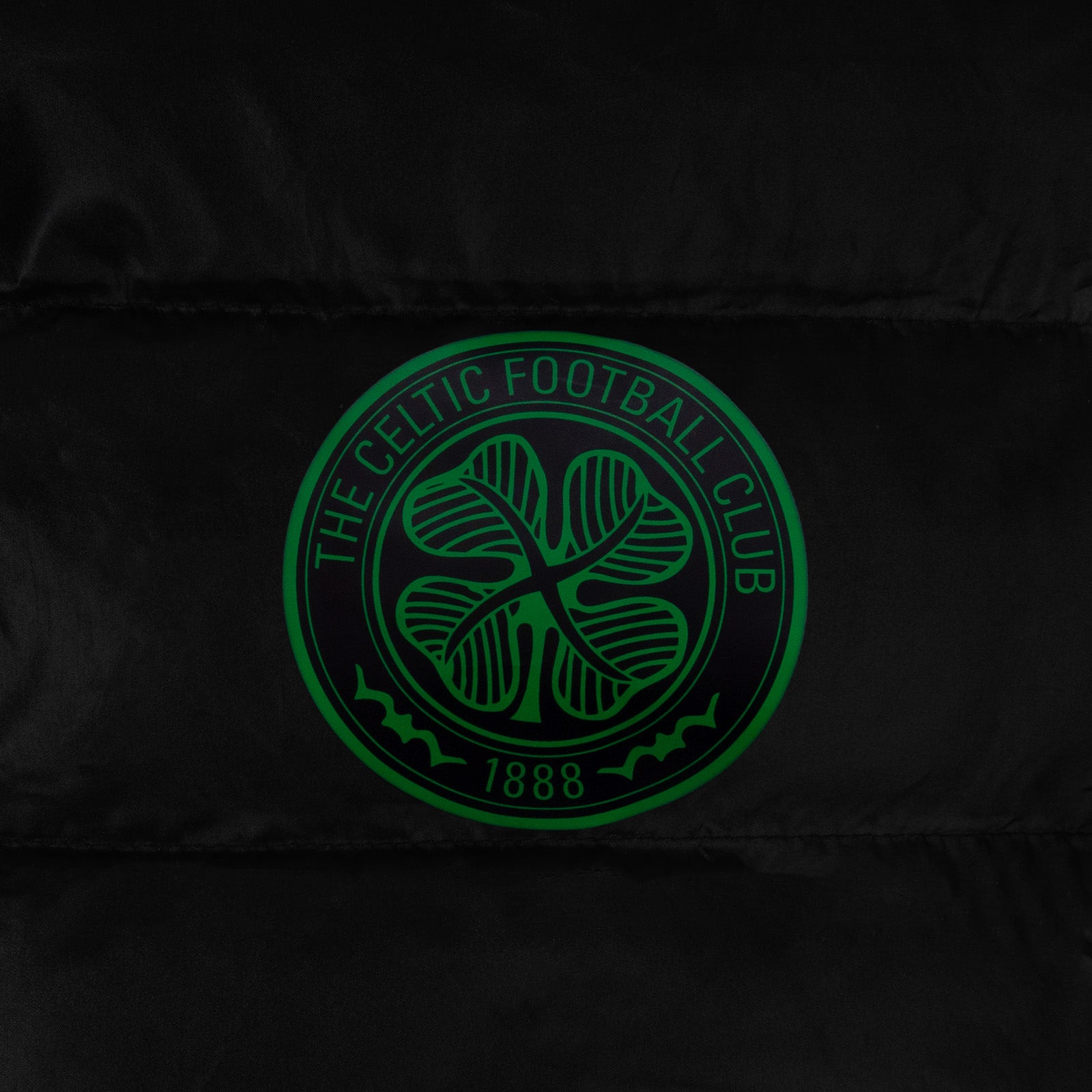 Celtic adults quilted jacket in black with club crest to the left of the chest.