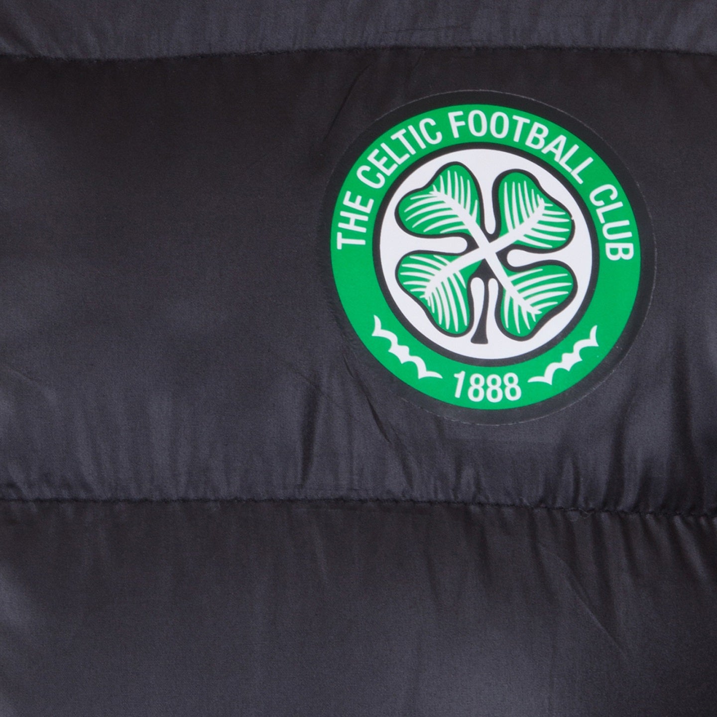 Celtic adults quilted jacket in black with club crest to the left of the chest.