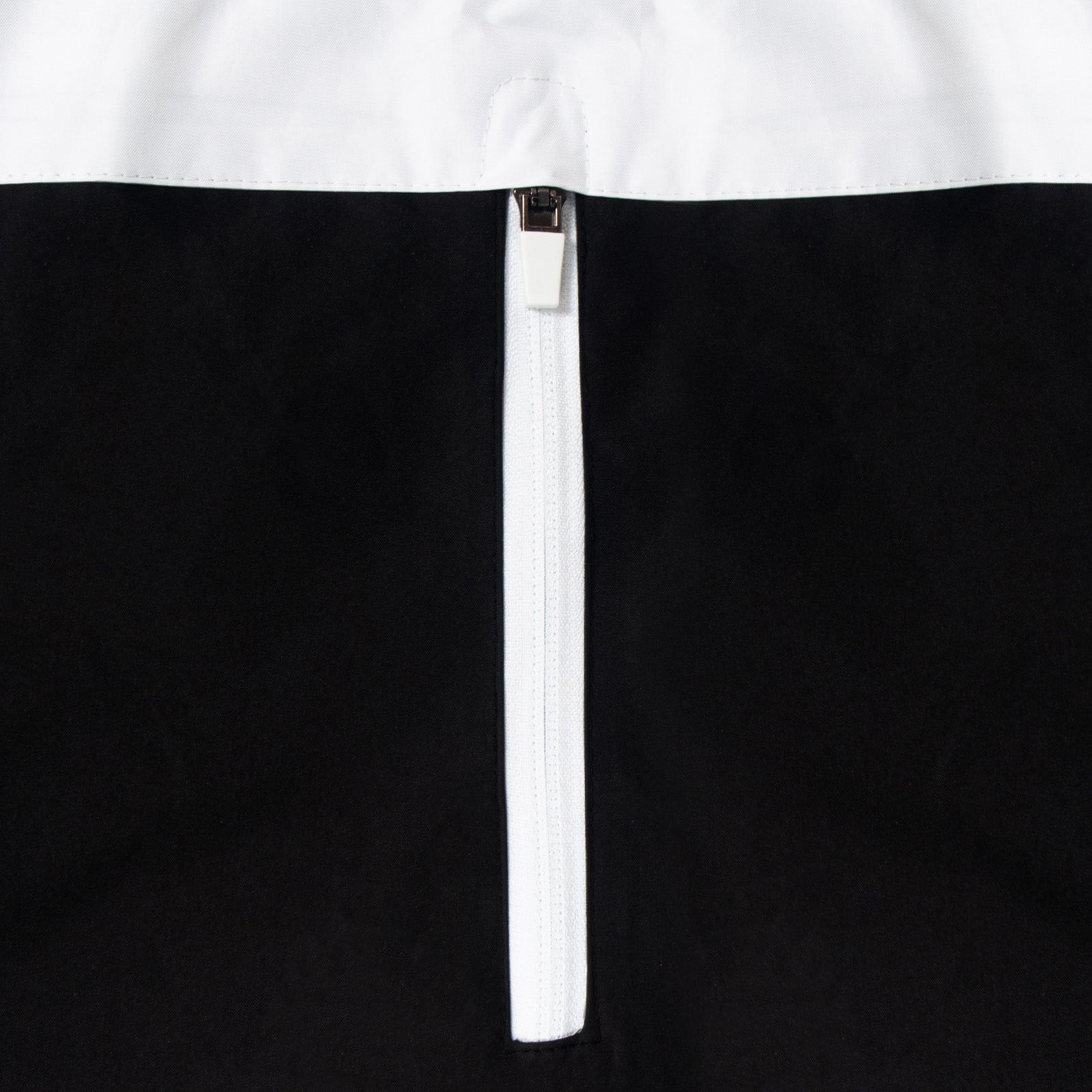 Newcastle Utdadults shower jacket in black & white with club crest to chest .