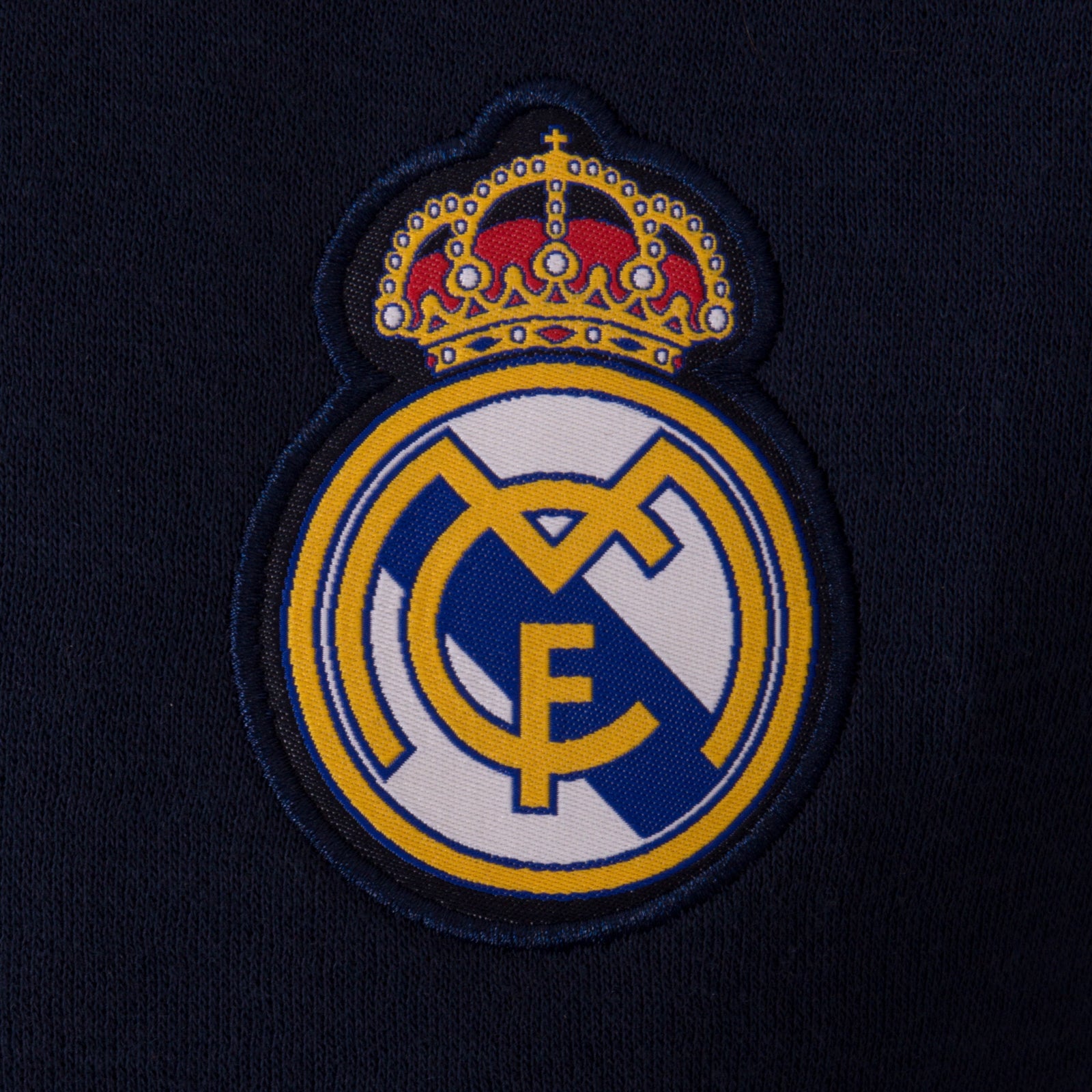 Real Madrid kids retro varsity jacket, fleece in navy blue with club crest to chest.