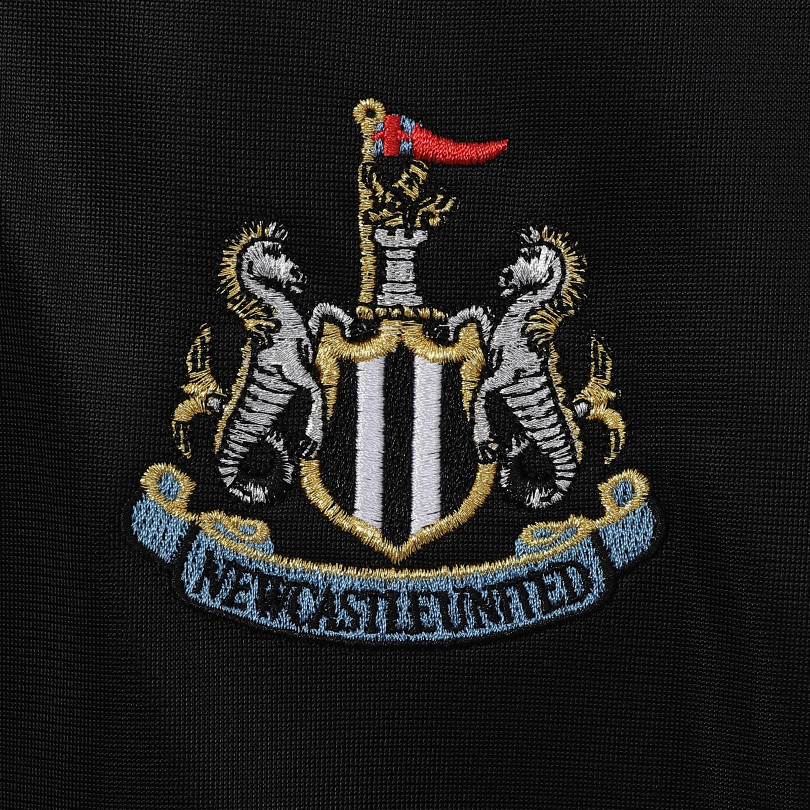 Newcastle Utd adults retro track jacket in black with club crest to chest.