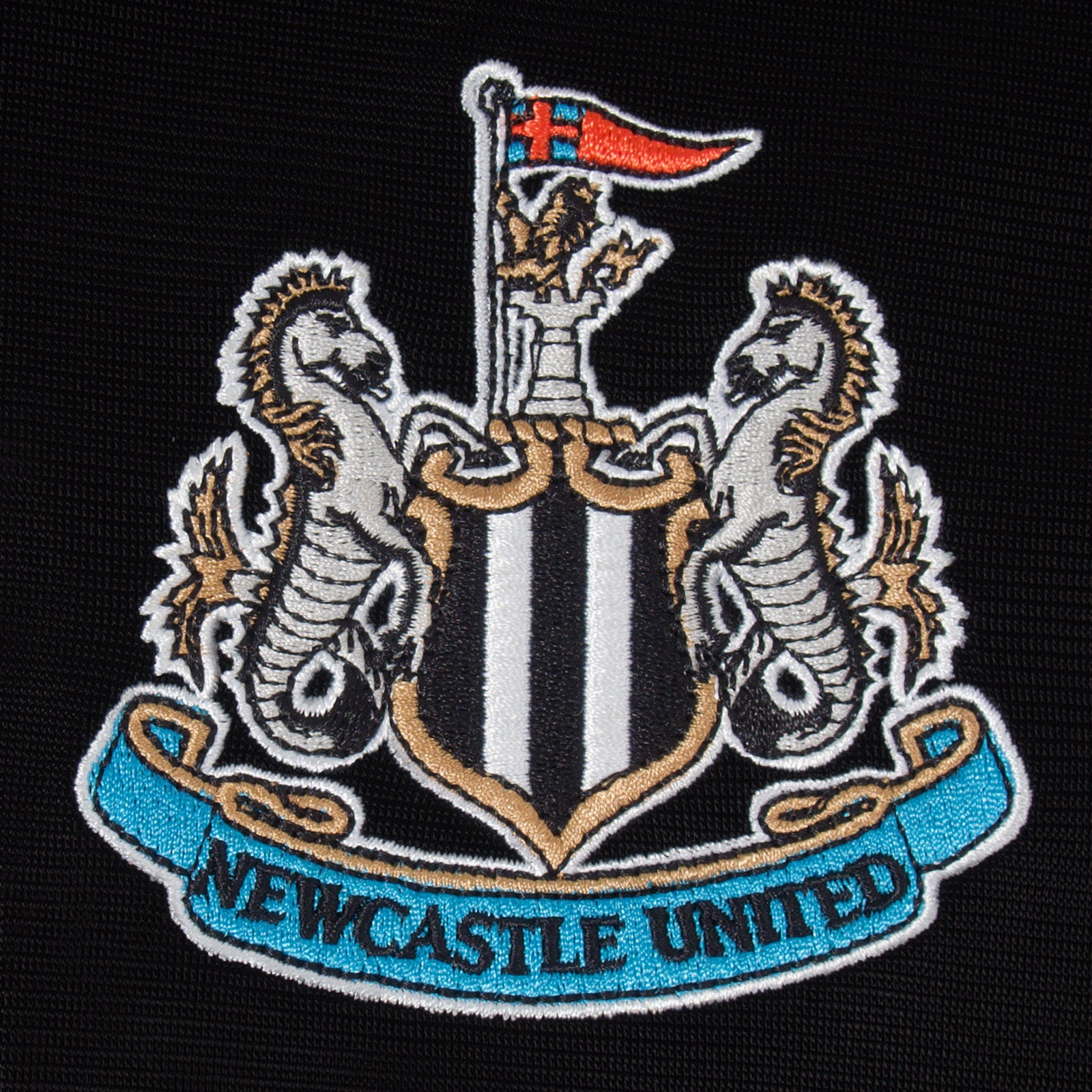 Newcastle Utd kids retro track jacket in black with club crest to chest.