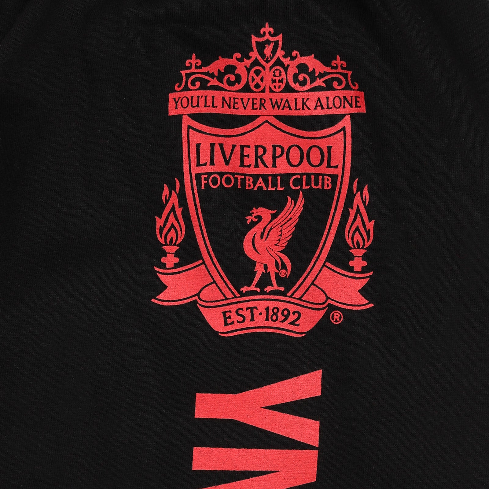 Liverpool kids long pyjamas in red. Long sleeve top with club crest. Long legged bottoms with crest.