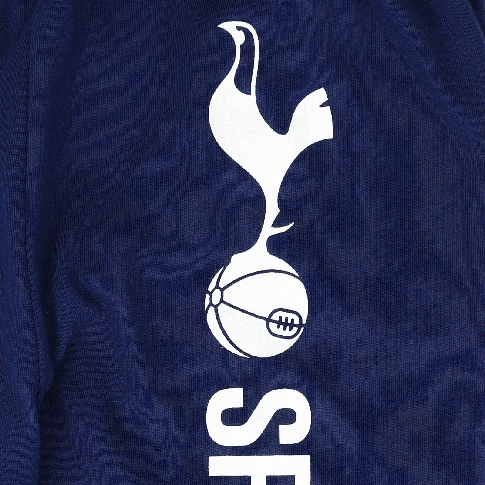 Spurs kids long pyjamas in blue incl a long sleeve top with graphic crest with long legged bottoms