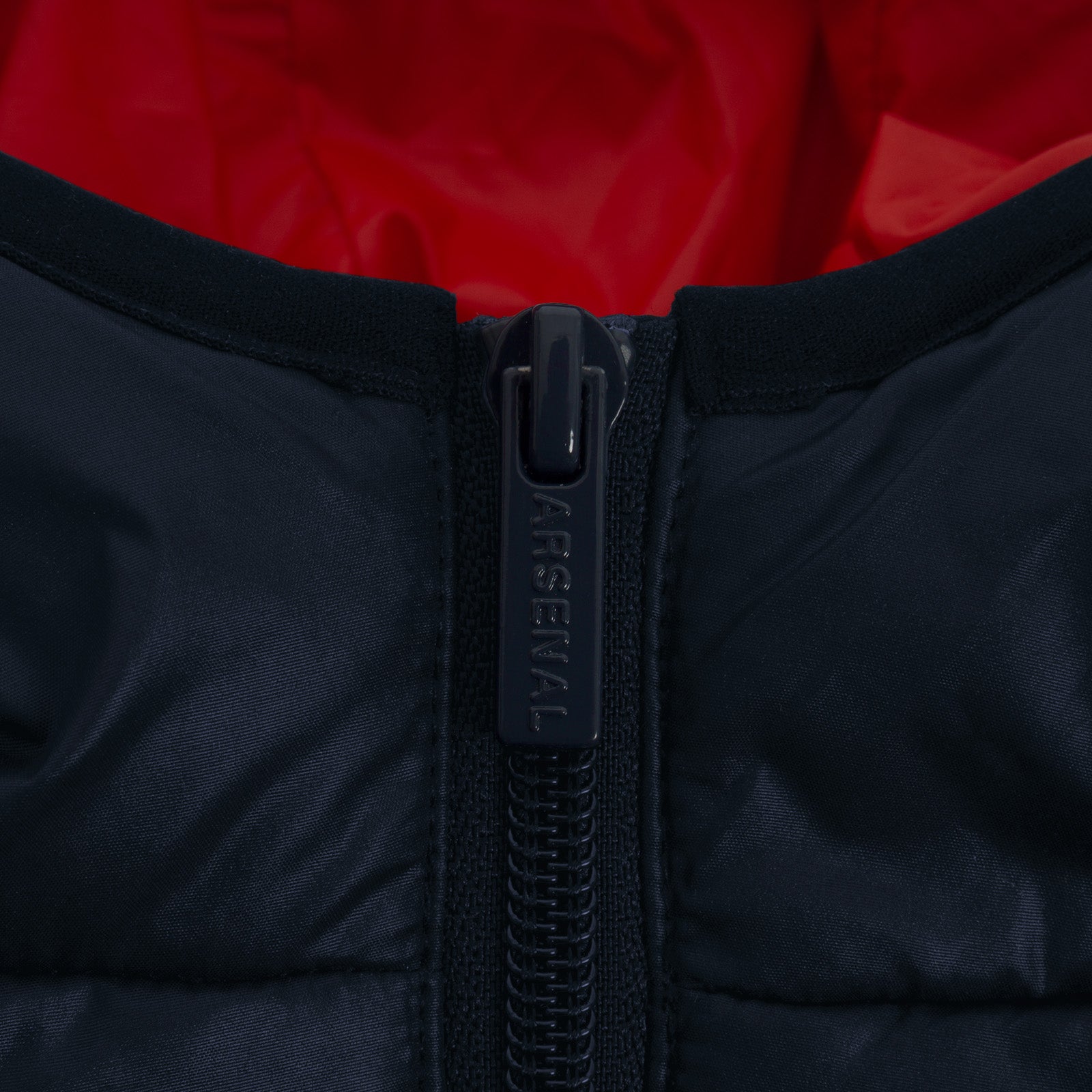 Arsenal kids quilted jacket in navy blue with club crest to chest.