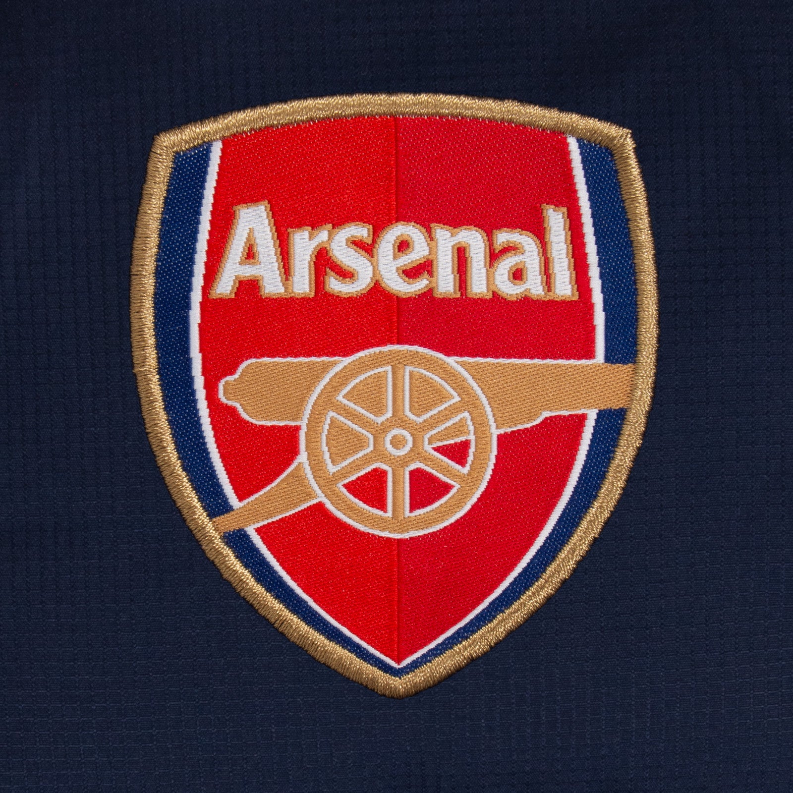 Arsenal kids quilted jacket winter coat in navy with club crest to chest.