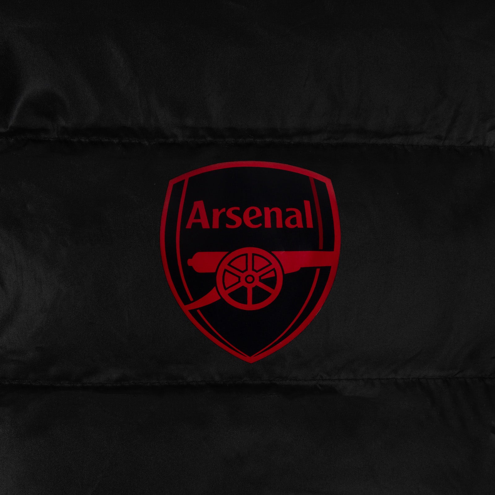 Arsenal adults quilted jackets in black with club crest to chest.