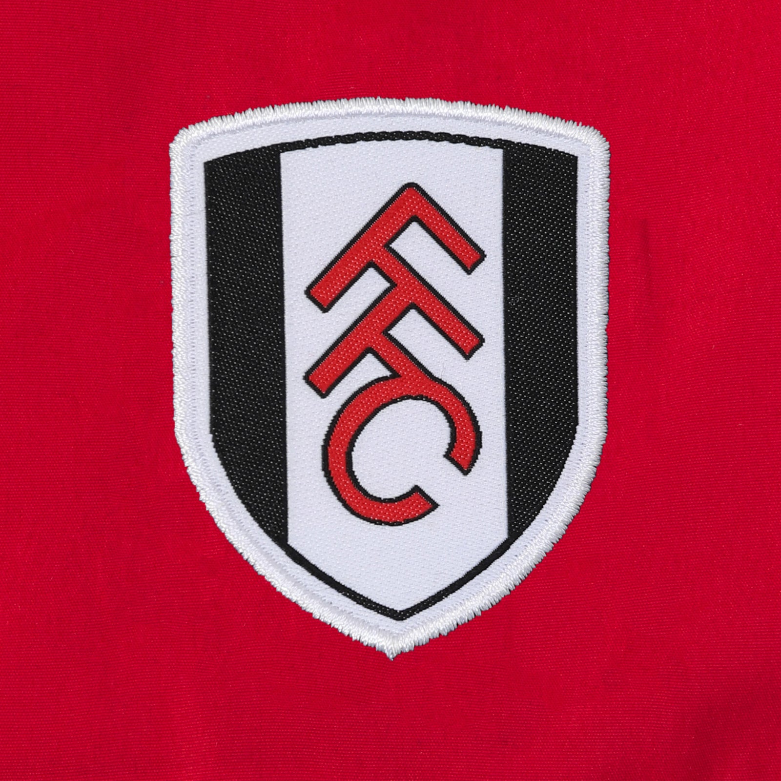 Fulham adults tracksuit in black with club crest to chest and left thigh