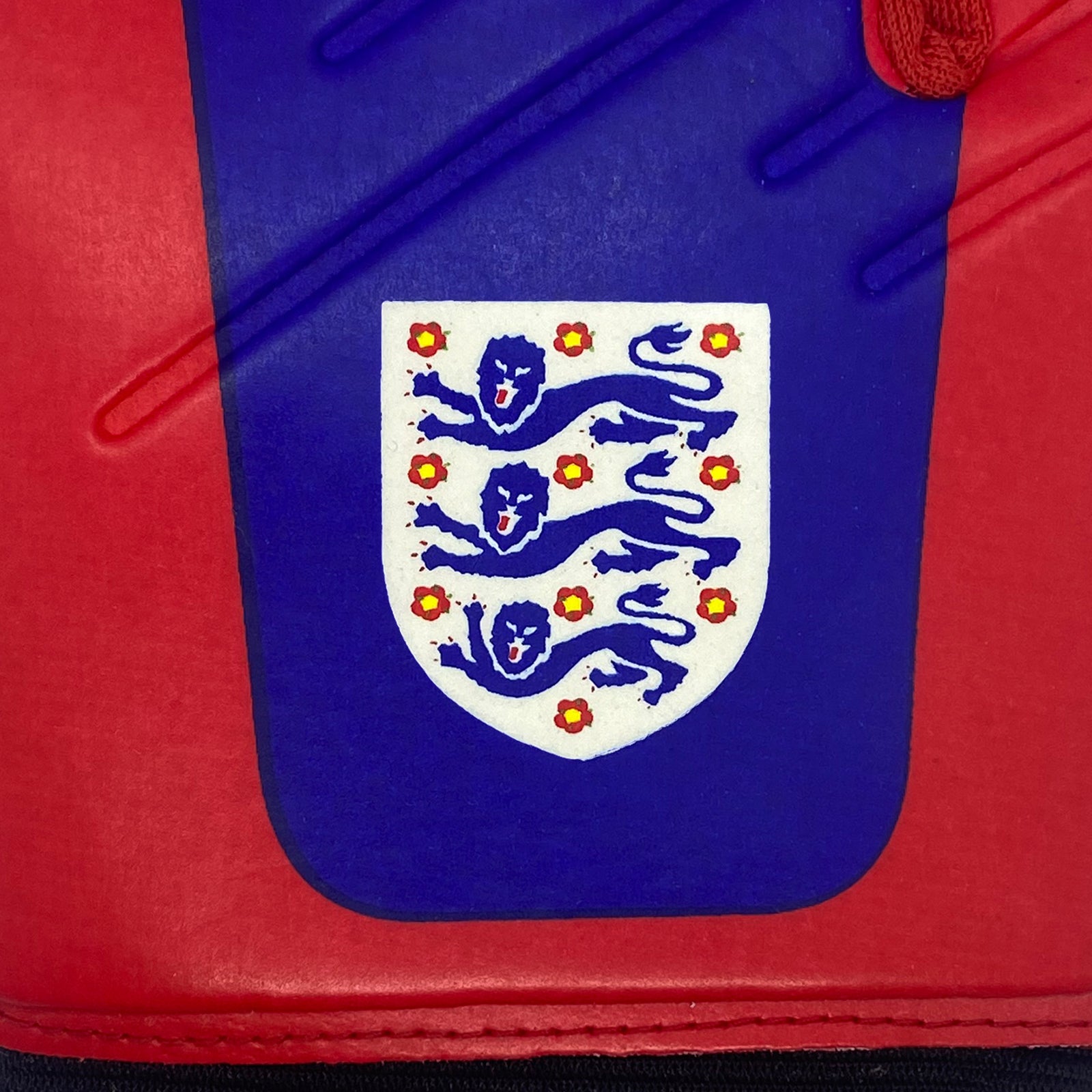 England goalkeeper gloves in red & navy blue with Three Lions crest & text print to each glove