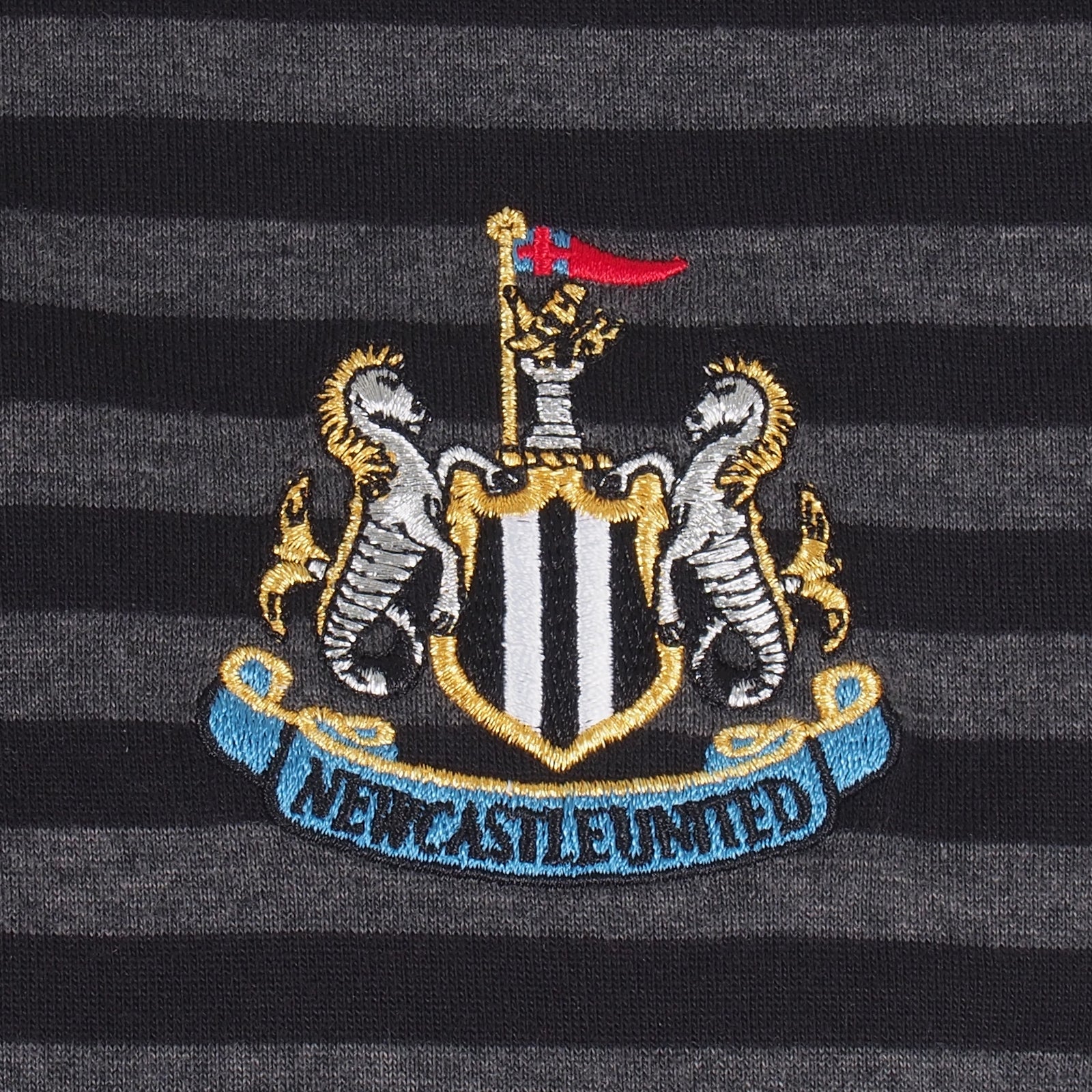 Newcastle Utd adults striped polo shirt in black & grey with club crest to chest.