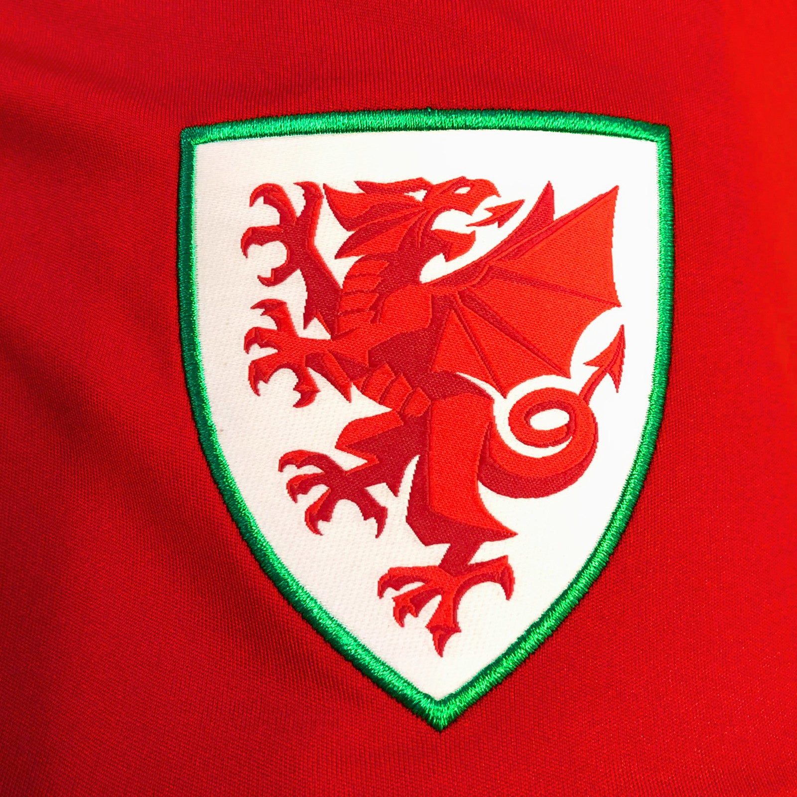 Wales FA adults poly T-shirt in red with woven national crest to chest