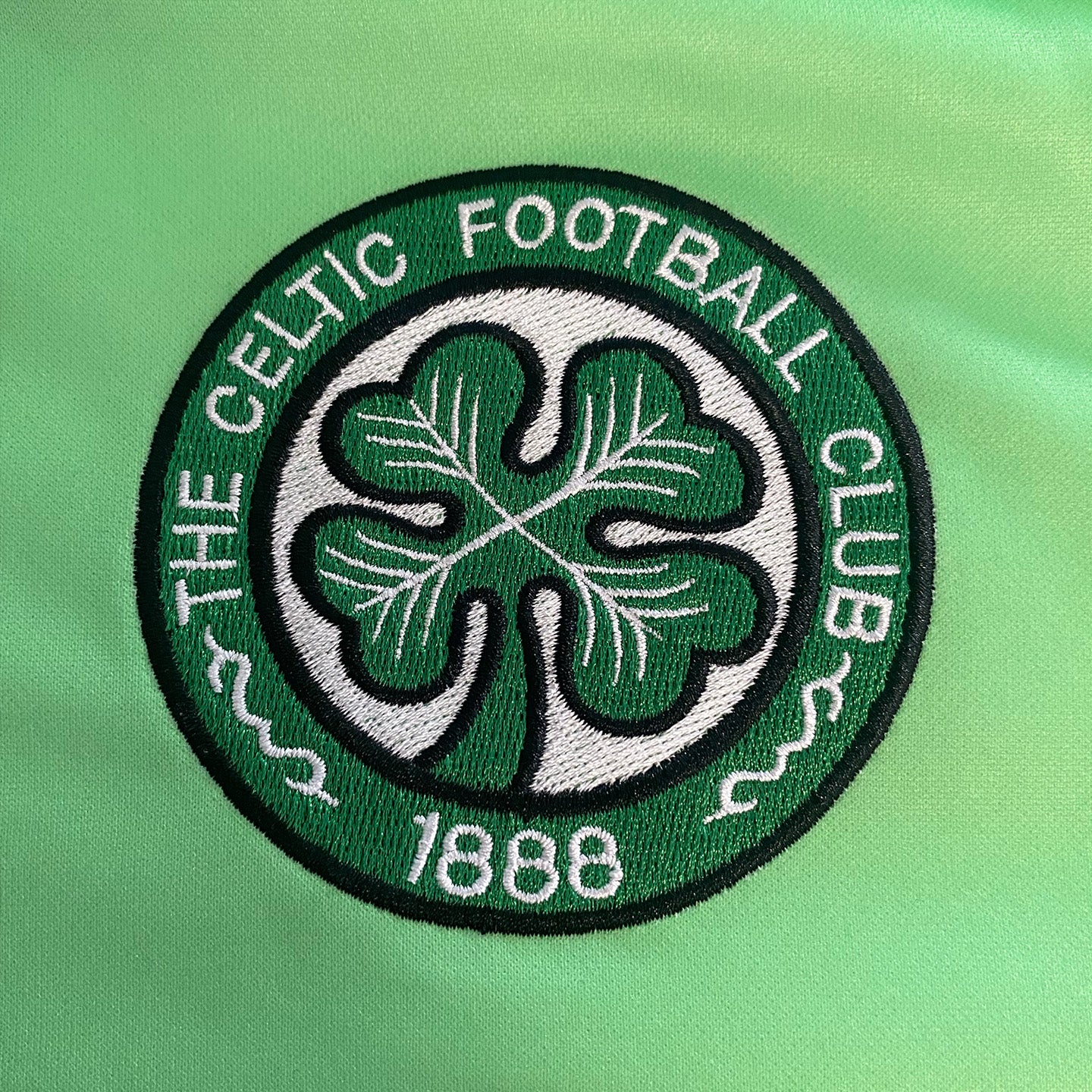 Celtic retro football shirt. Replica 1984/86 away shirt in green with club crest and sponsor print to front