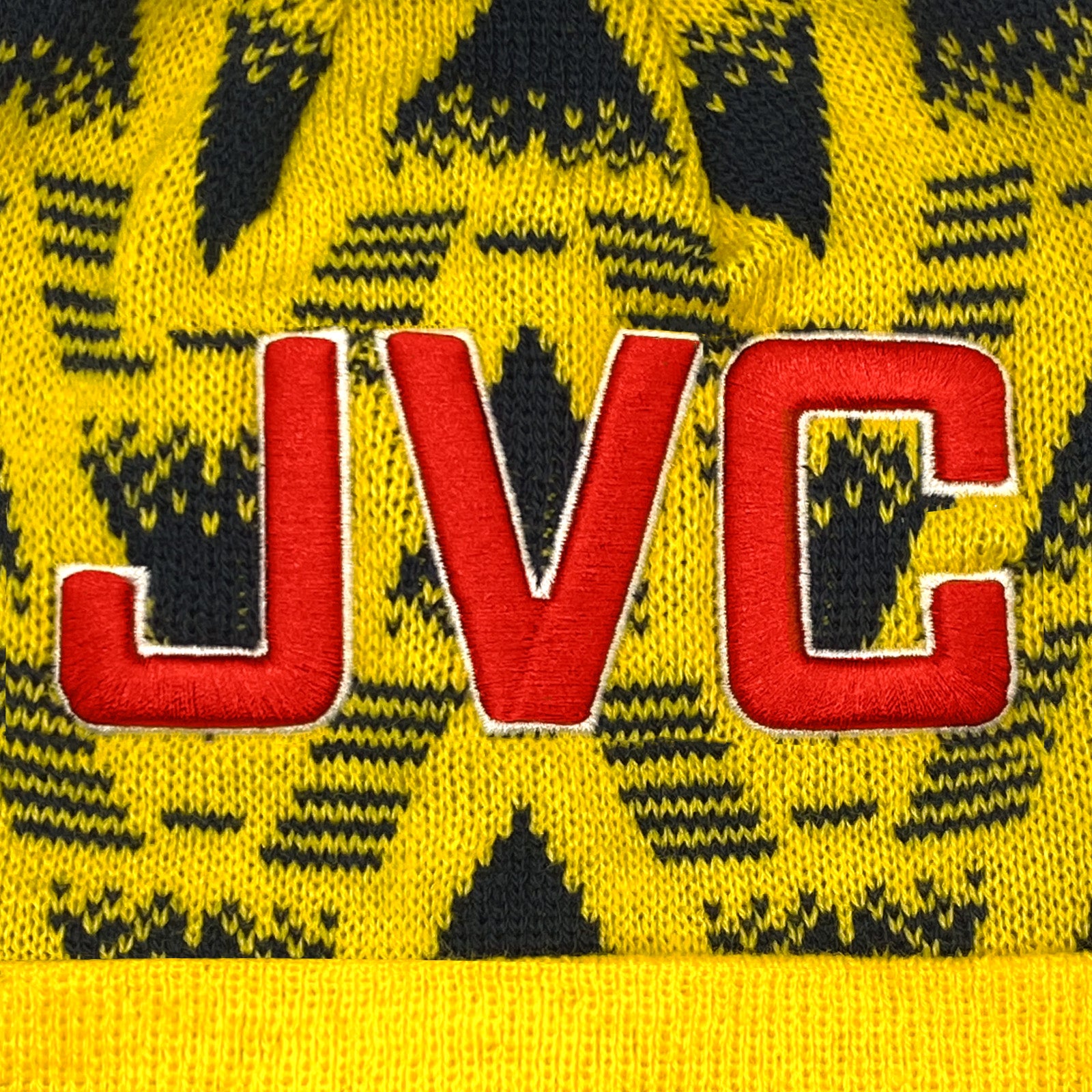 Arsenal retro knitted bobble hat in yellow with text to front