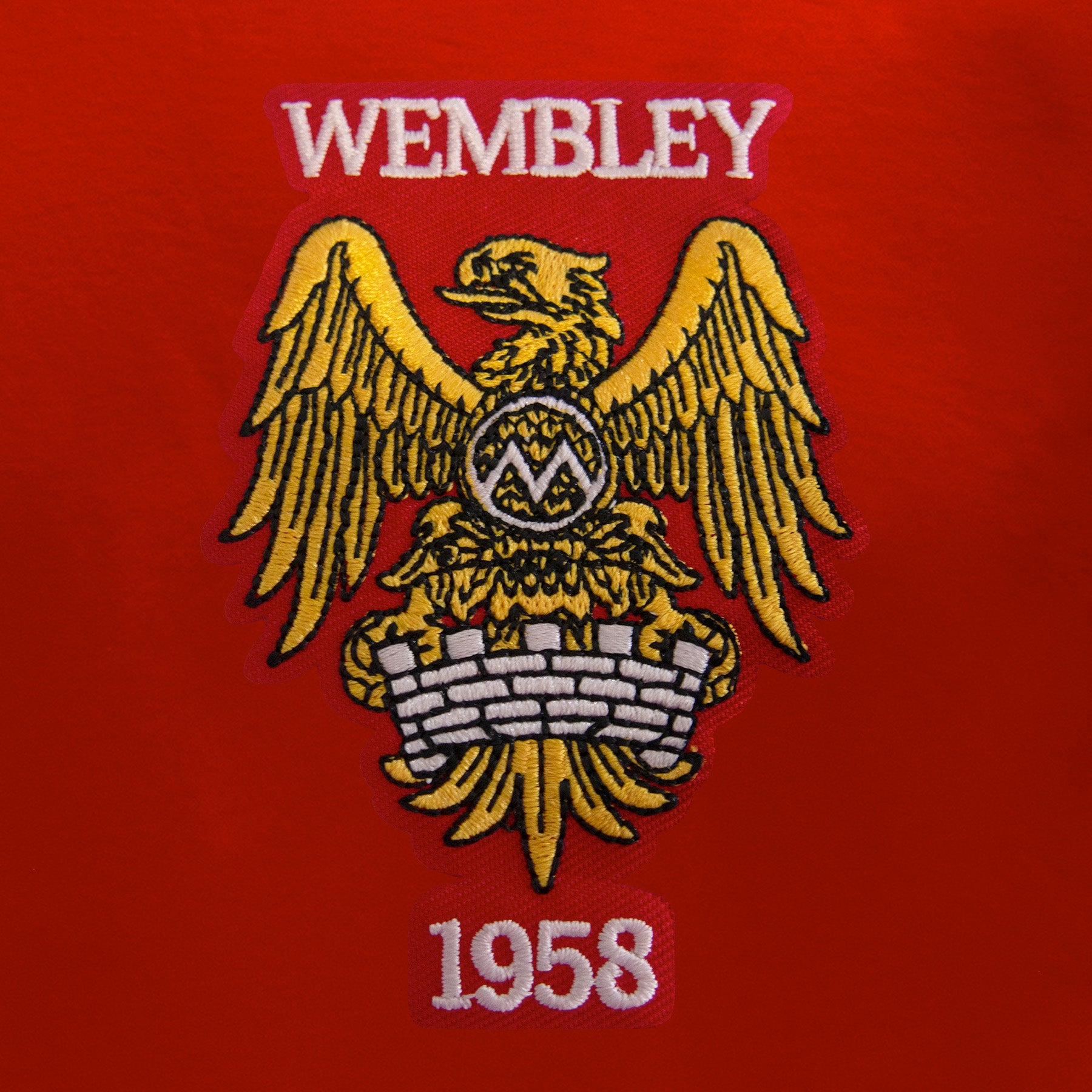 Man Utd adults retro T-shirt in red featuring Manchester and Wembley 58 crest