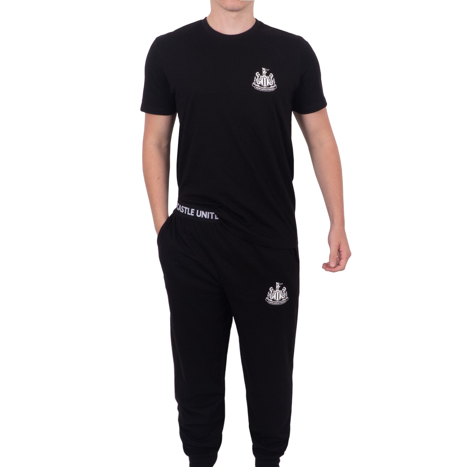 Newcastle United adults long pyjamas in black and white. Short sleeve top featuring club crest to chest. Long bottoms with club crest to leg and NEWCASTLE text on the waistband