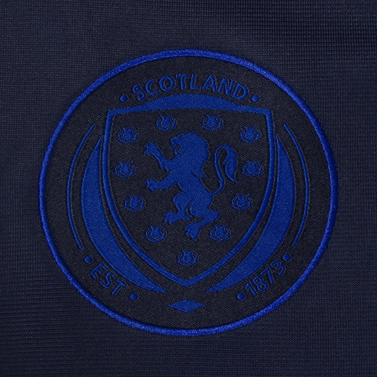 Scotland kids taped tracksuit in navy blue with SFA team crest and text to both top & pants
