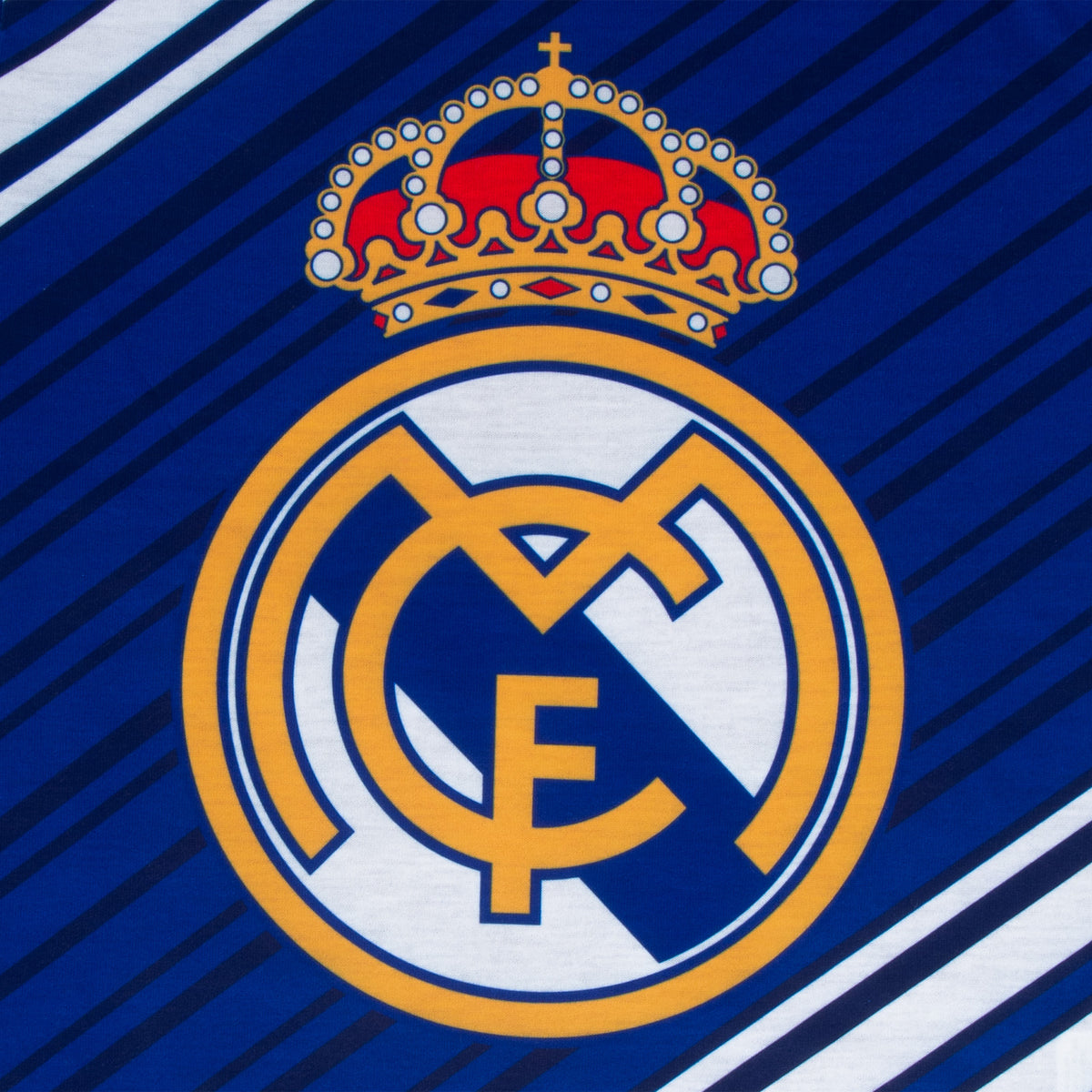 Real Madrid kids long pyjamas in reflex blue. Long sleeve top featuring the club crest. Long legged bottoms with the club crest and Real Madrid Text.