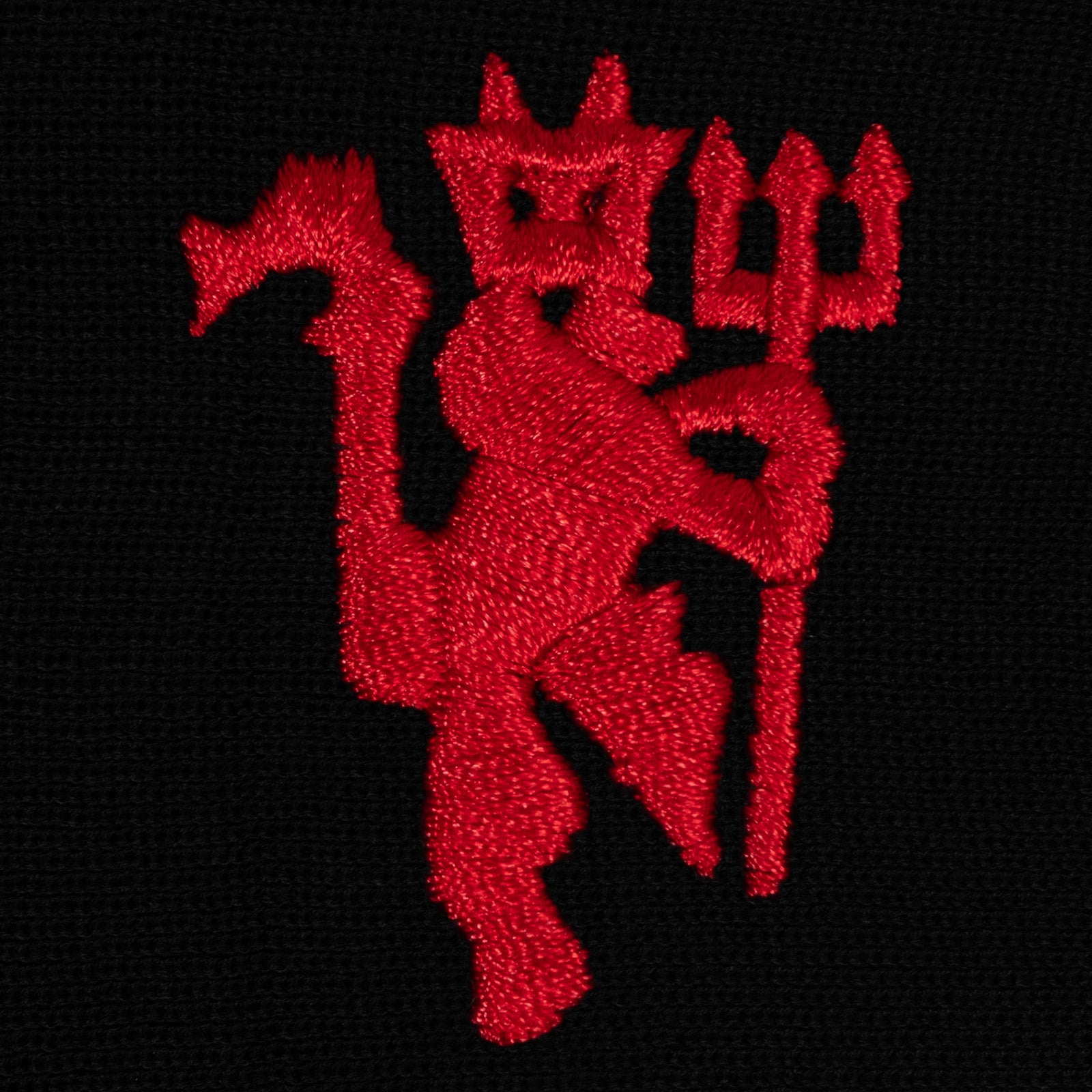 Manchester United beanie hat in black with red devil club crest to the front