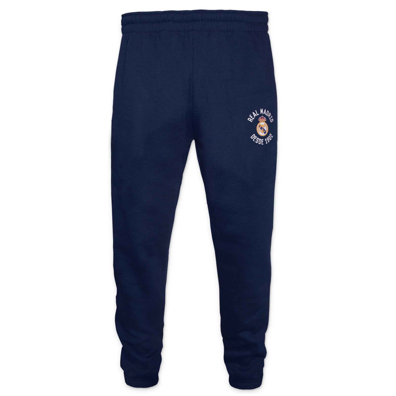 Real Madrid kids slim fit track pants in navy blue with club crest and text to left leg.